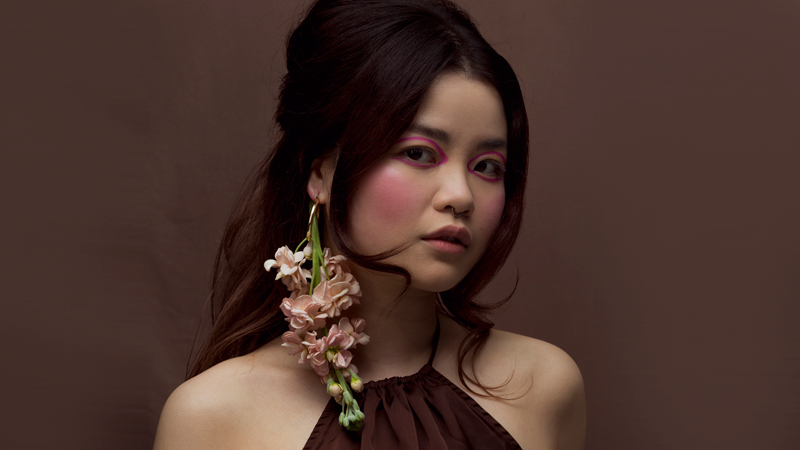 Beauty shoot with real flowers as earrings.