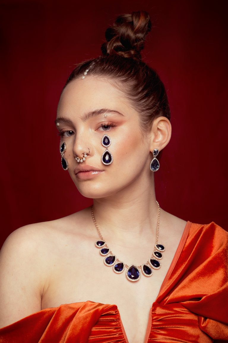Model wearing elegant jewellery, showcasing a sophisticated and stylish look. Baroque beauty fashion shoot.